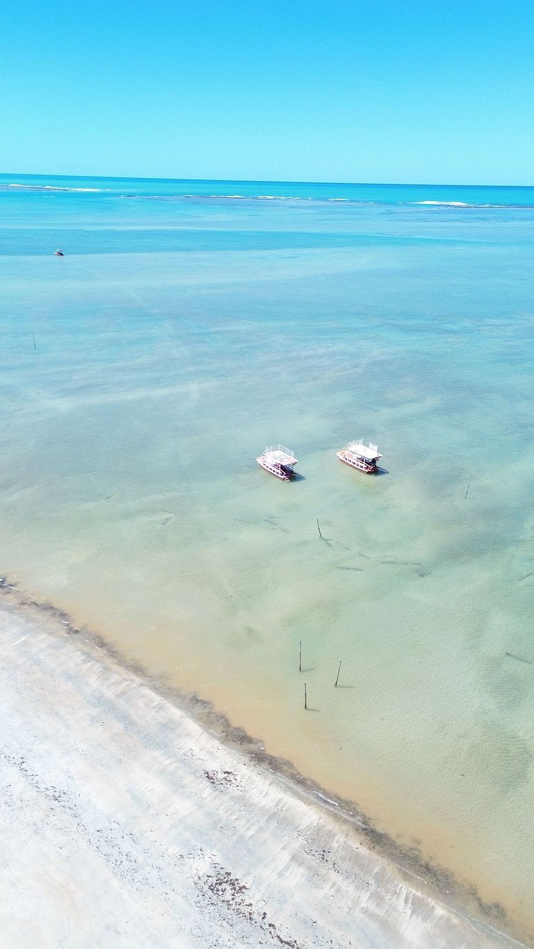 Casas duplicadas à 30 m da praia c/ serviço